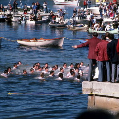 Boys competing to retrieve the Epiphany Cross